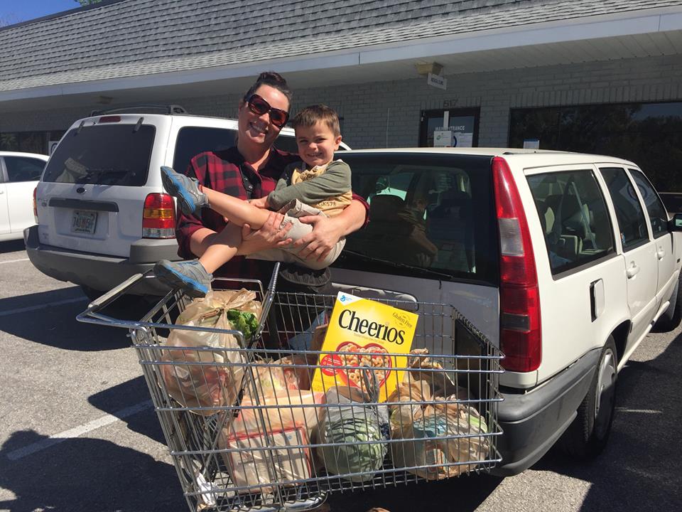 Mother receiving food at ECHO Food Bank